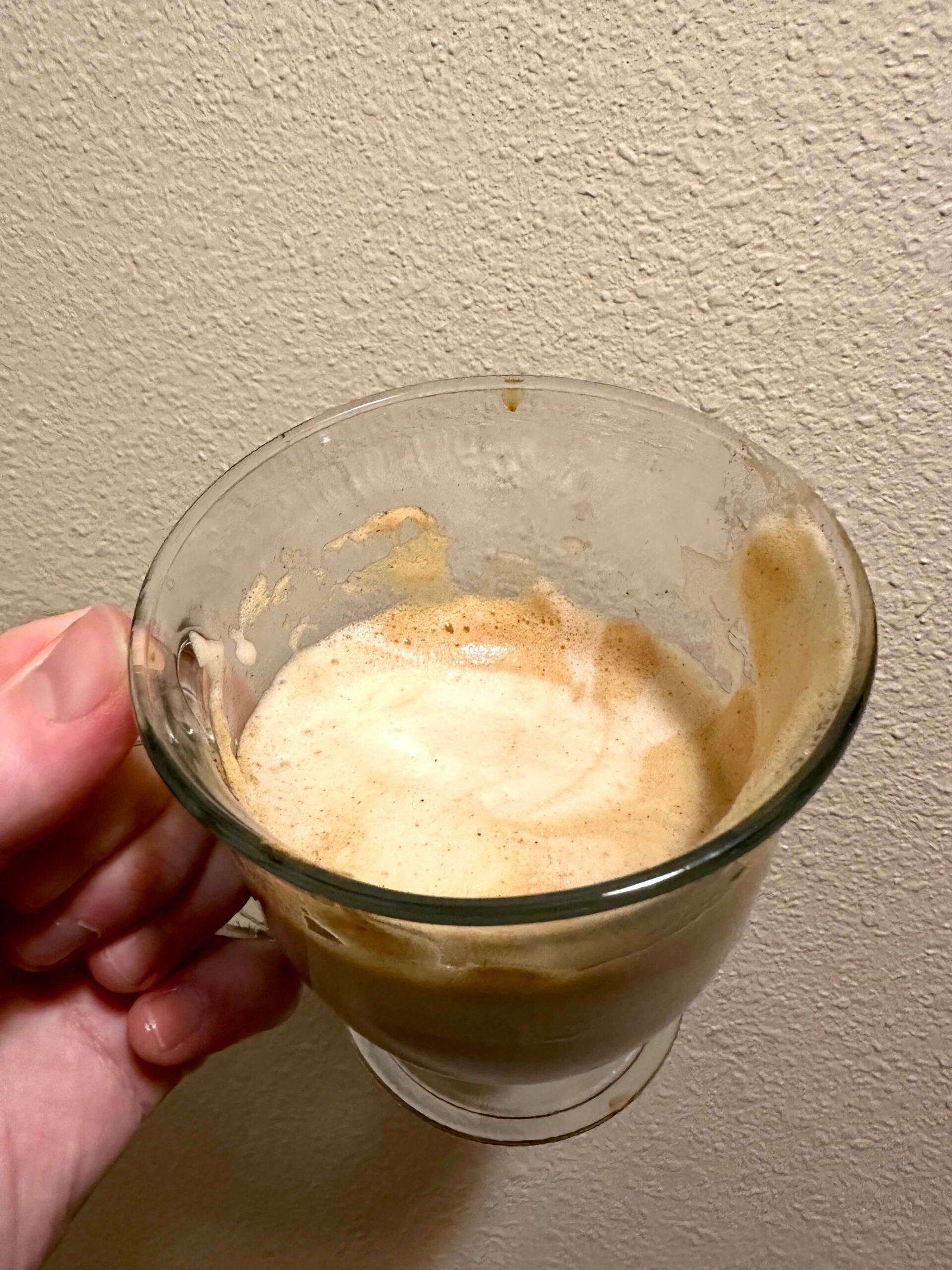 frothy mocha latte Nescafe Gold Recipe Frothy mixture of golden-amber colored coffee from the Nescafe Gold mixture with the Silk Chocolate soy milk in a clear glass cup.